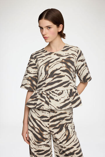 Model wearing zebra top
