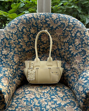 Yellow bag on floral chair