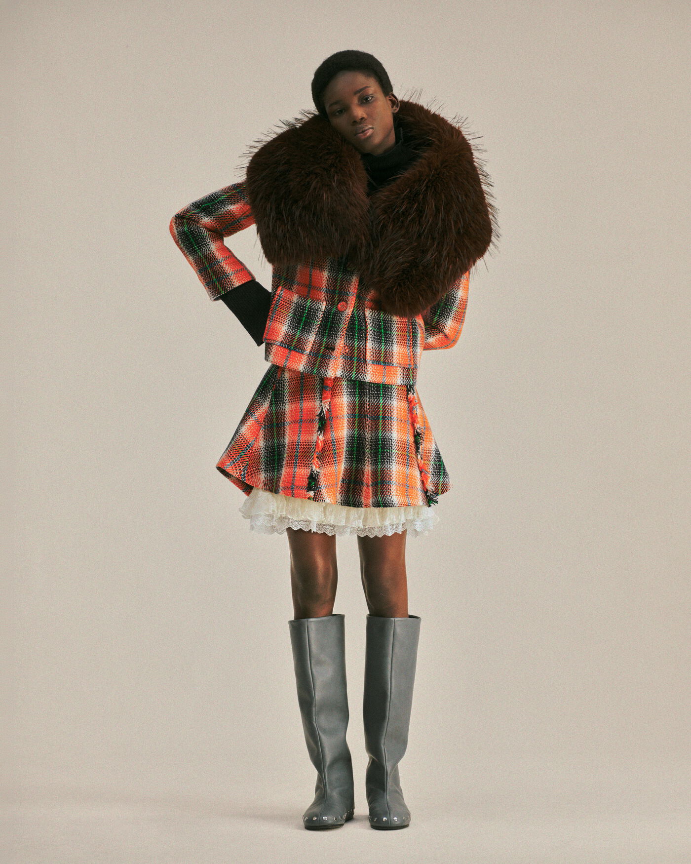 GANNI orange checked look framed by a deep brown faux-fur collar