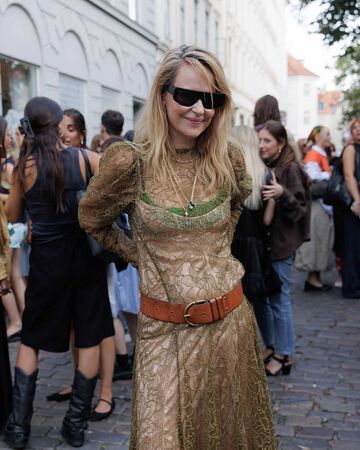 Creative Director Ditte Reffstrup wears lace dress at the GANNIxSTEM afterparty