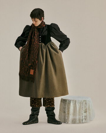 Model wearing a green dress from the Fall/Winter 2026 collection