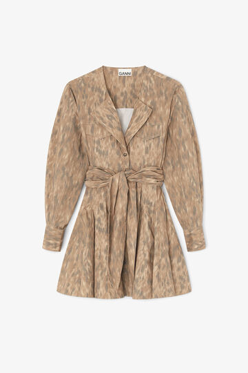 Model wearing long leopard dress with deep v-neck