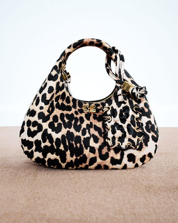 GANNI Small Hobo Bag in leopard print leather featuring a braided top handle