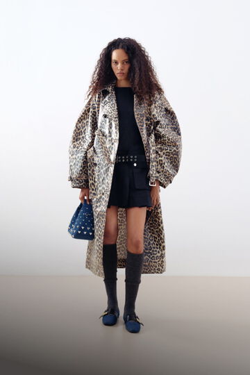 Model wearing leopard laminated coat and denim stud Hobo bag