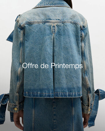 Close up of model wearing denim skirt and jacket